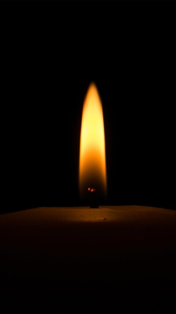 black wallpaper with candle