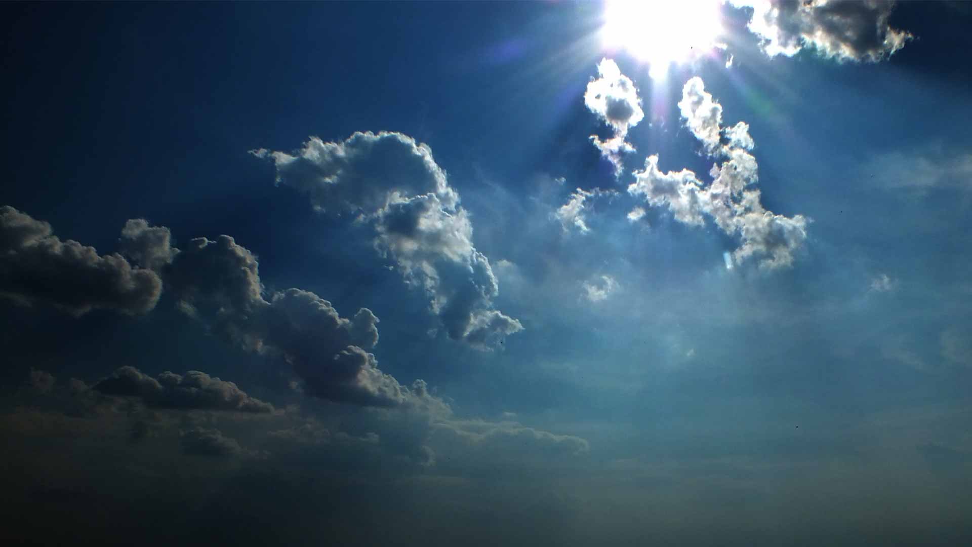 dark clouds wallpaper with blue sky background