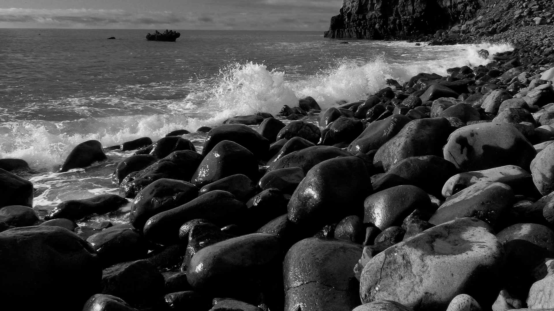 black stones at beach background image
